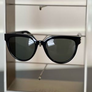Black YSL sunglasses.